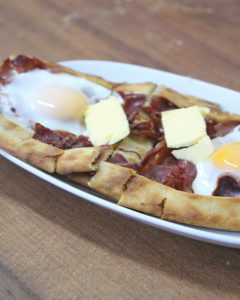 Turkish pide with egg and pastrami